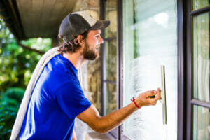 Man Washing with Window Cleaning Tools