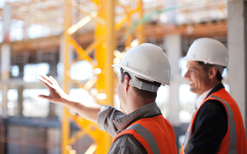 Contractor on Site Using Invoice Software