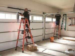 Garage Door Software used by two Men on Ladders